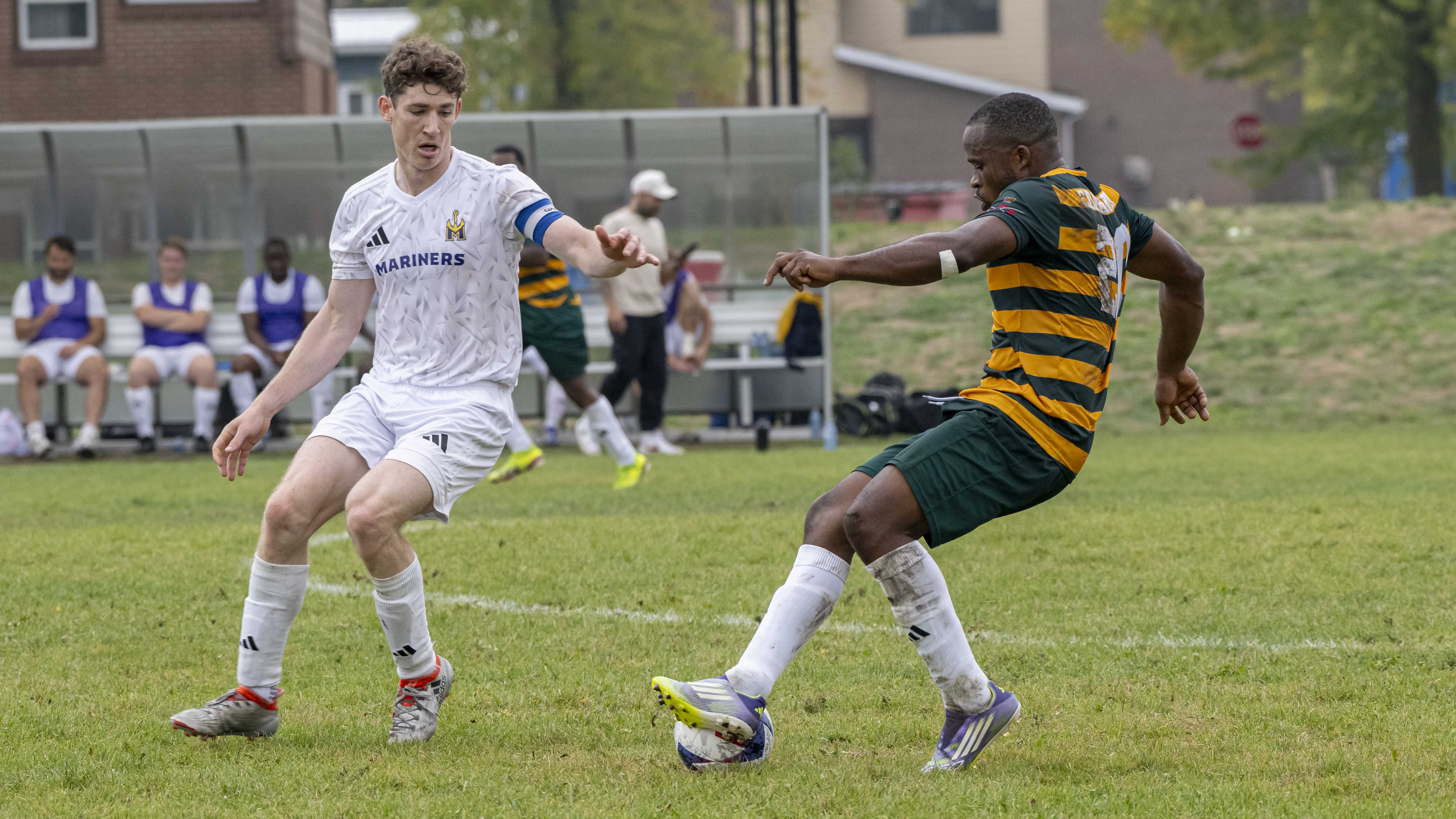 2 men playing soccer