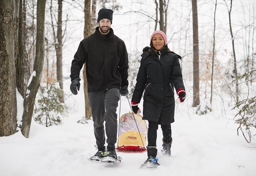 people snow shoeing