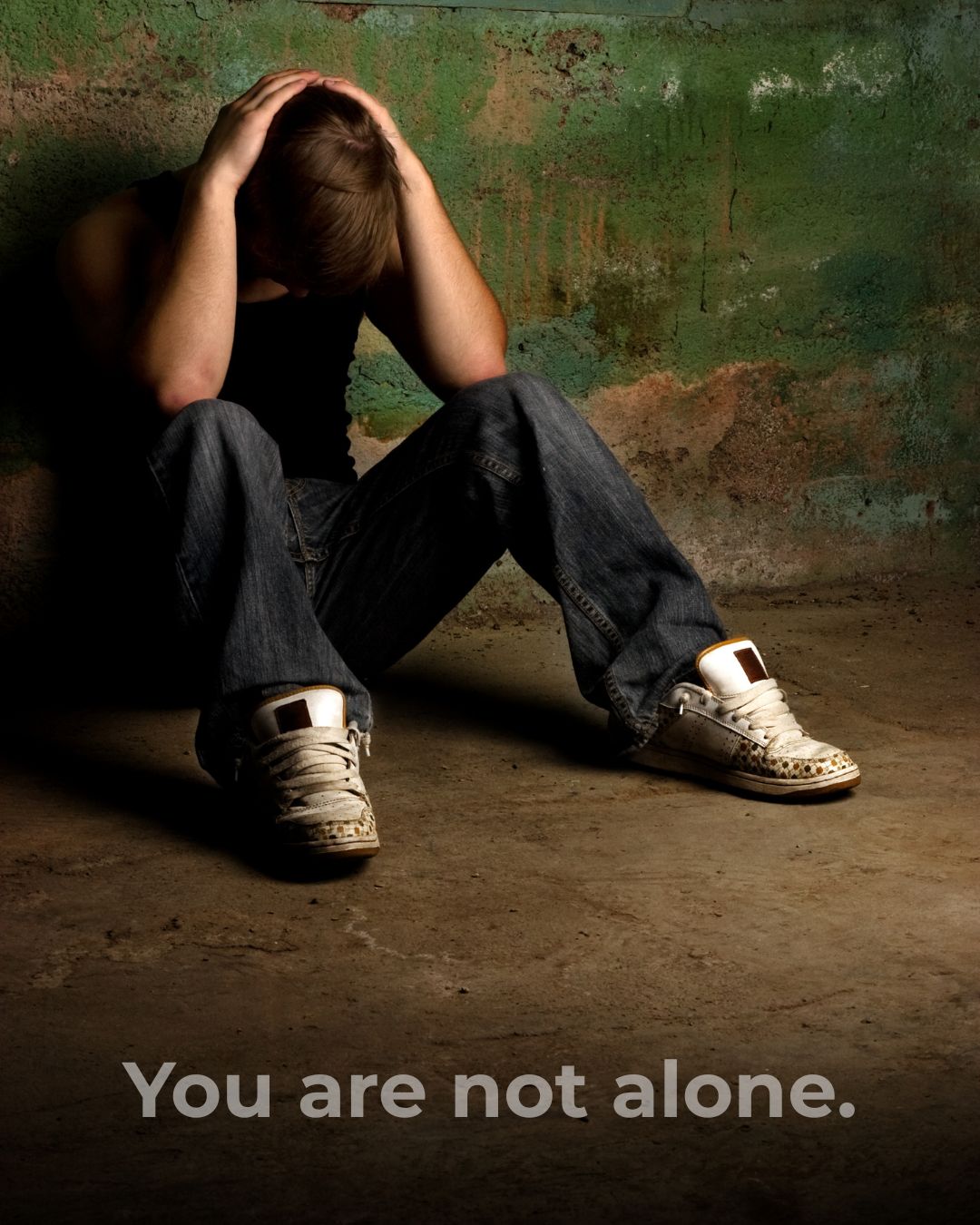 Person struggling with text: You are not alone.