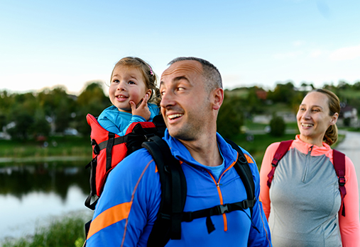 Family walking and smiling