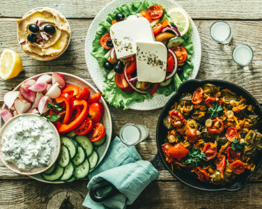 A table with Mediterranean food dishes.