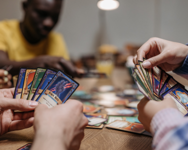 People playing a card game at a table