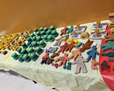 A display of various rubber and sponge stamps on a table.