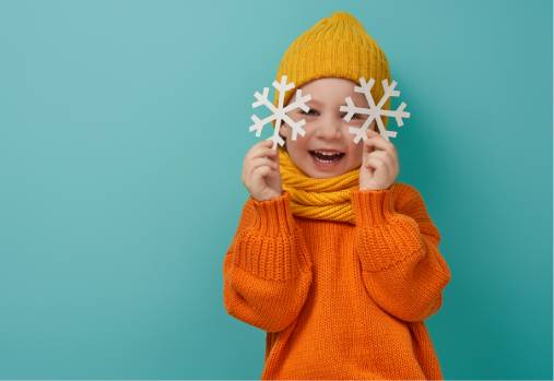 young child with snowflakes