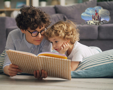 Adult and child reading a book together.