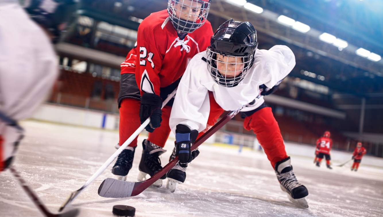 2 kids playing hockey