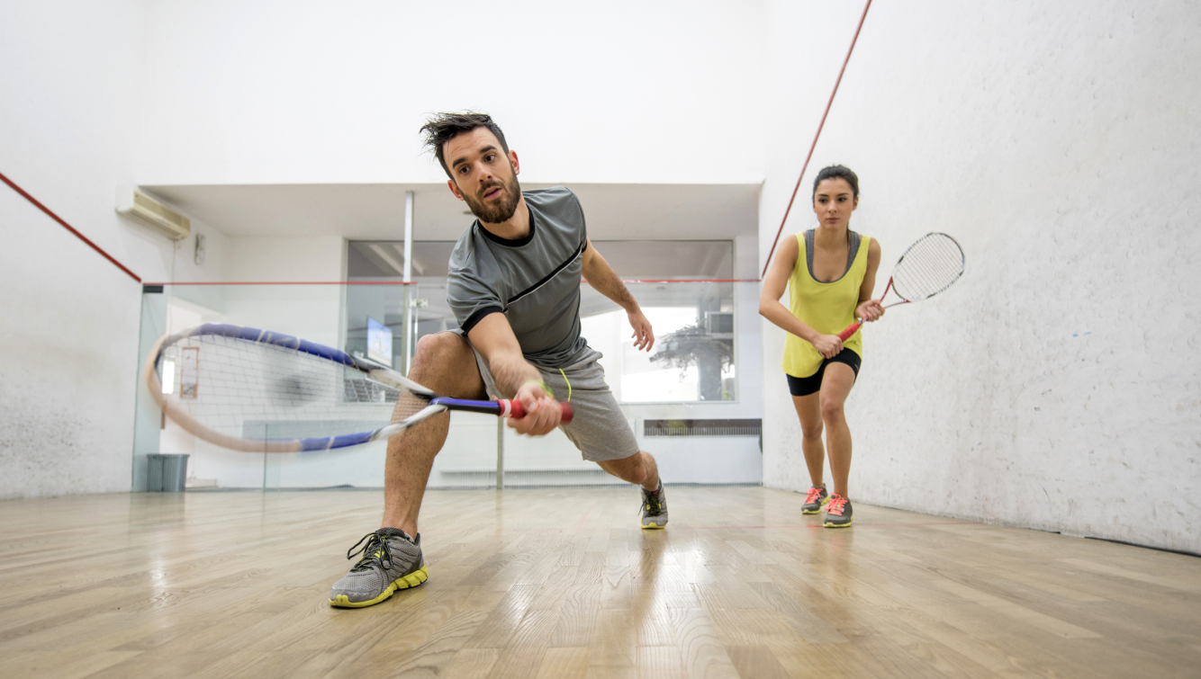 2 people playing squash