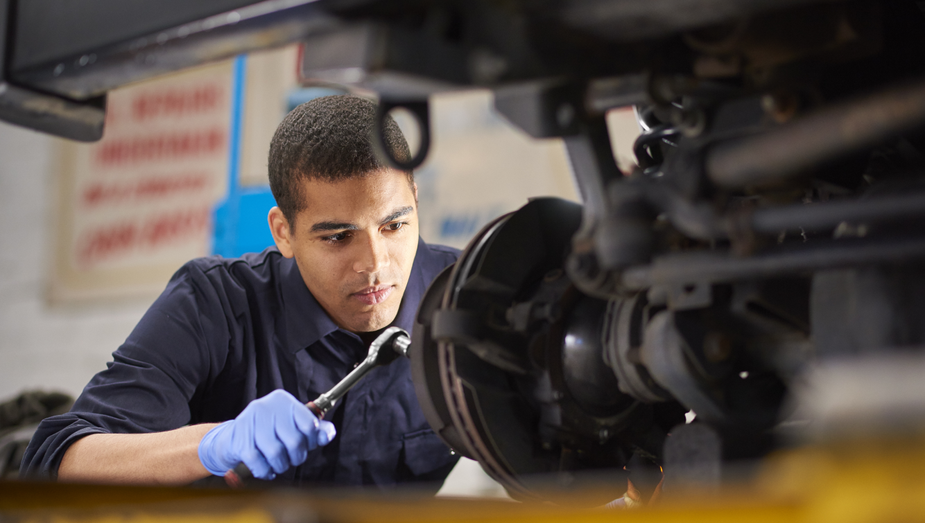 man working on car