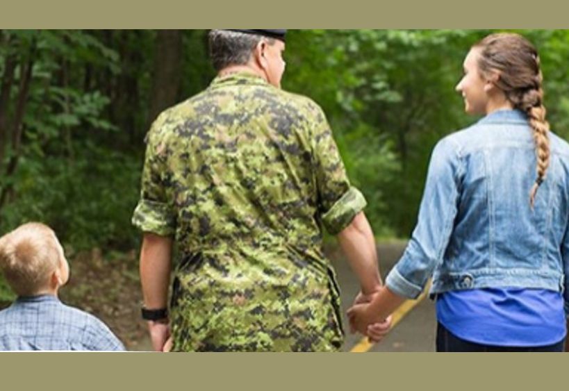 Military family, son holding member's hand