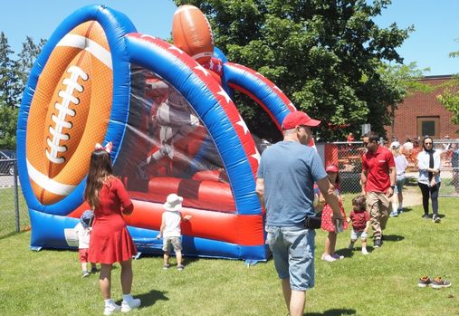community event with inflatables and families