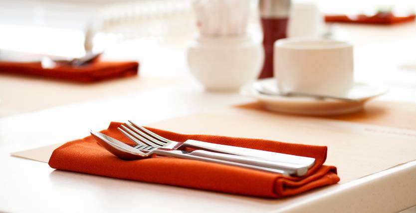 utensils and cups on a table