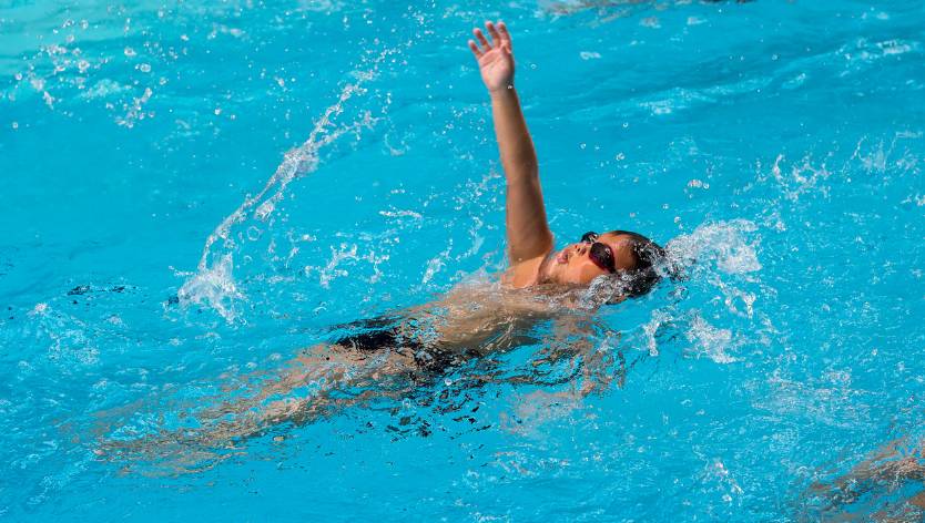 kid swimming in a pool