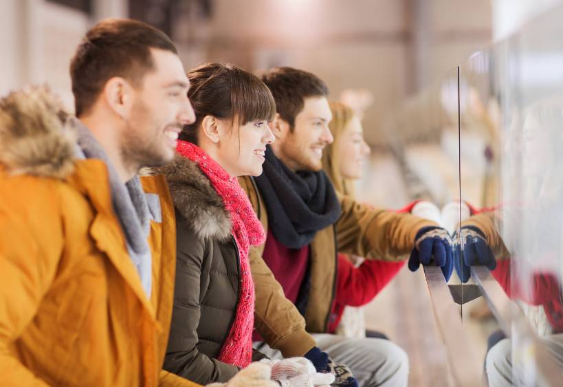 People watching a hockey game at the stadium