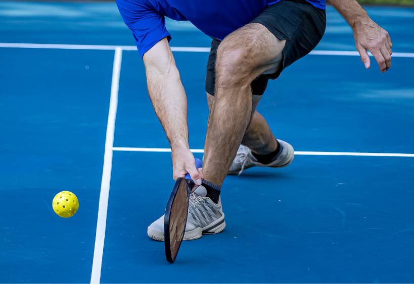 Man playing indoor pickleball