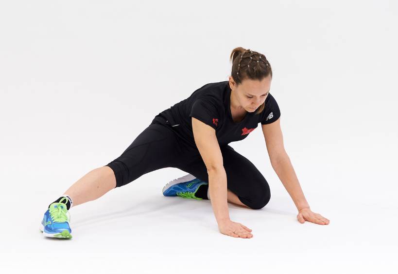 Fitness instructor stretching