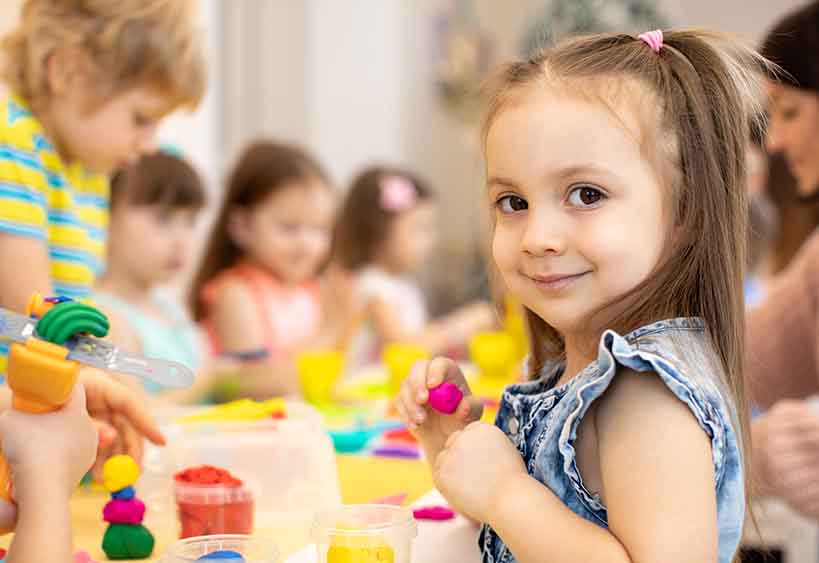 children playing and making crafts