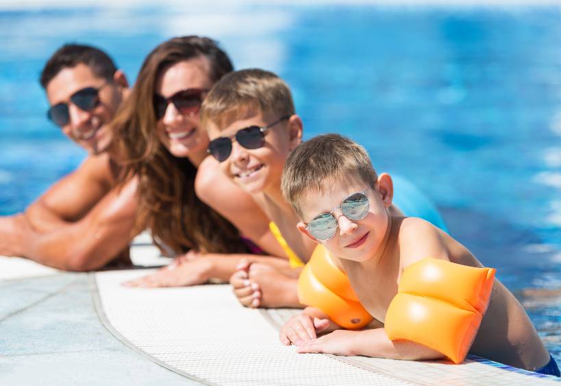 family in an outdoor pool