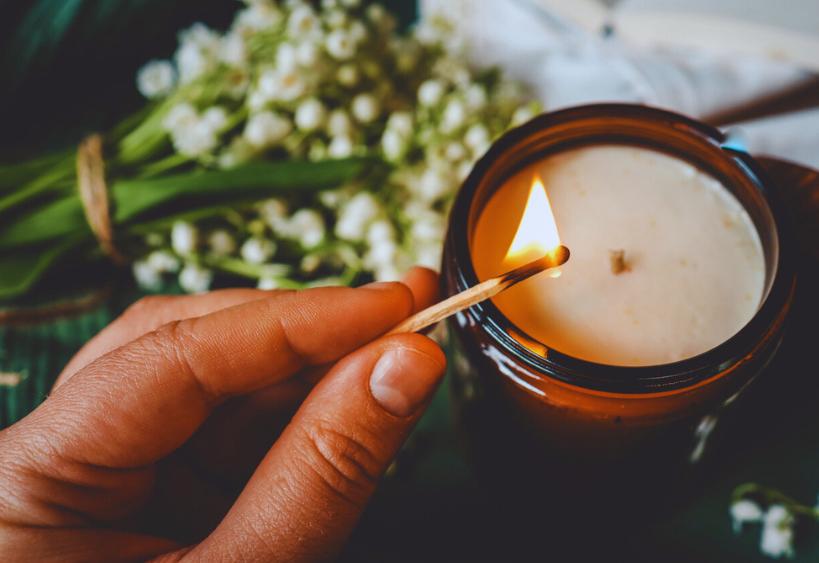 Woman lighting candle