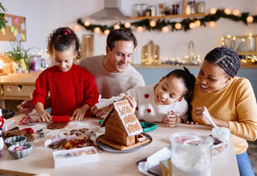 Family decorating gingerbread house