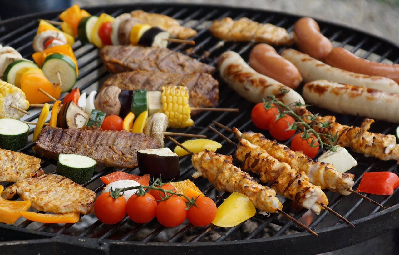 Grilling meat and vegetables on bbq