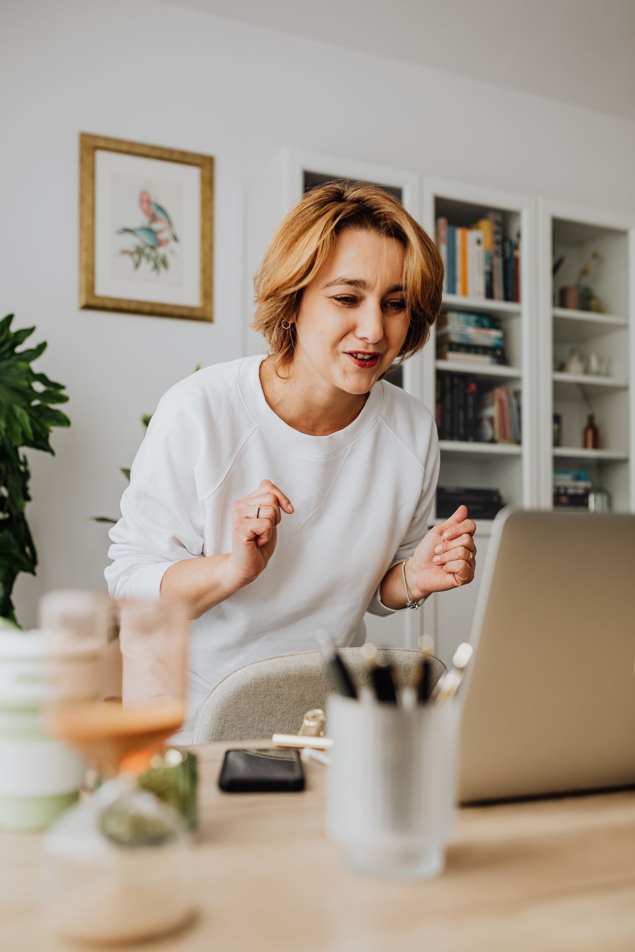 woman talking to a laptop