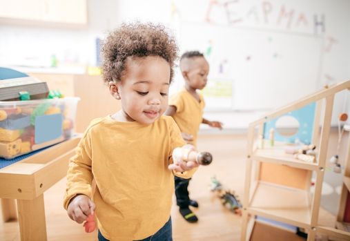 toddler holding a toy