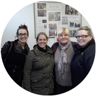 four women standing together