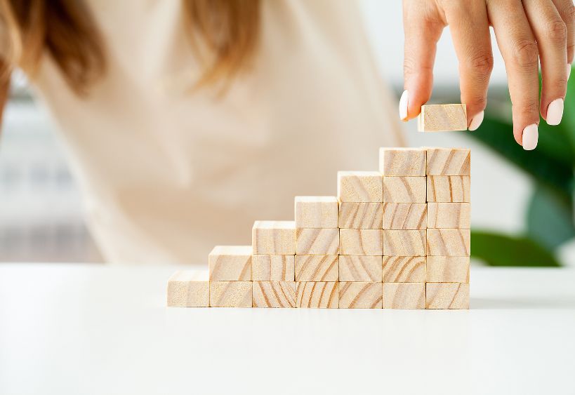 woman stacking blocks