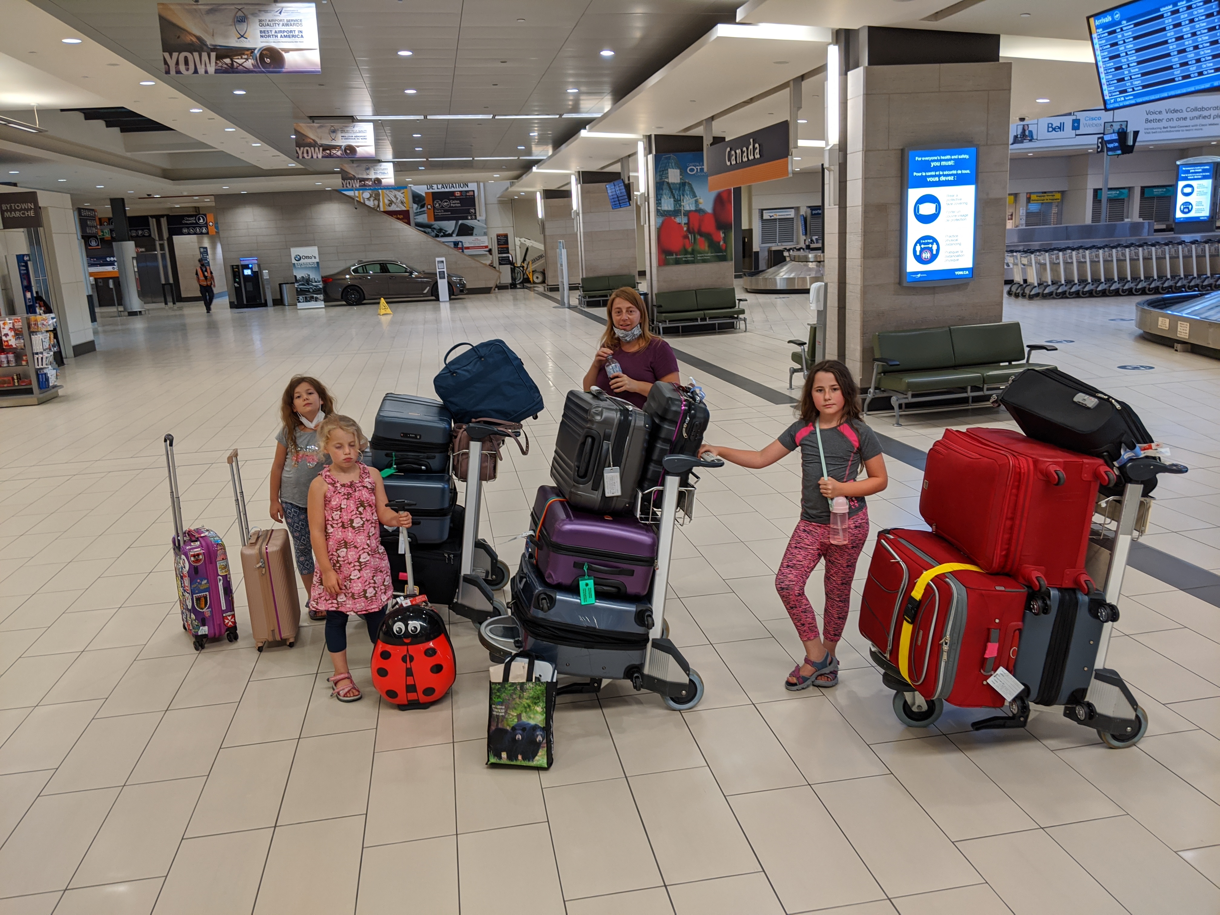 kids at the airport with suitcases