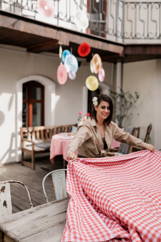 woman setting out table cloth