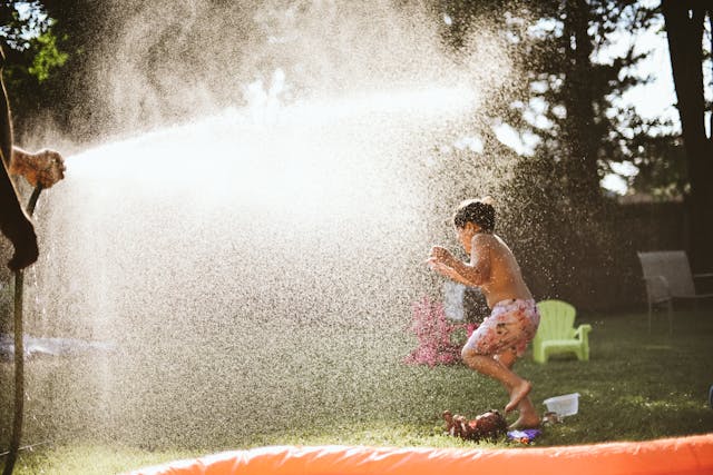 Boy Playing On Lawn