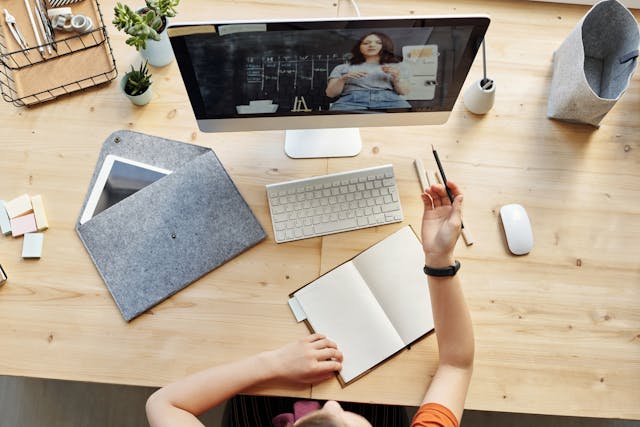 Top View Photo of Girl Watching video on computer