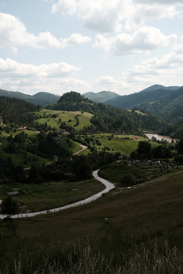 A scenic view of a winding road in the mountains