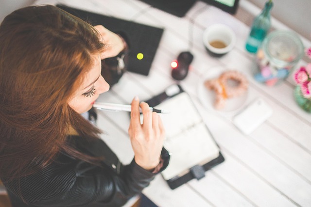 aerial view of woman sitting at desk
