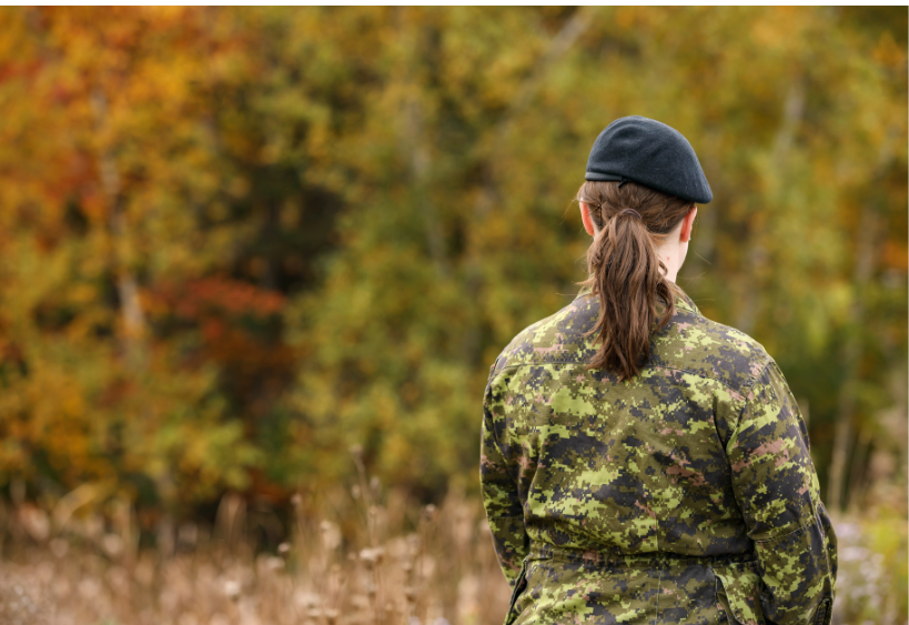 female army officer standing backon