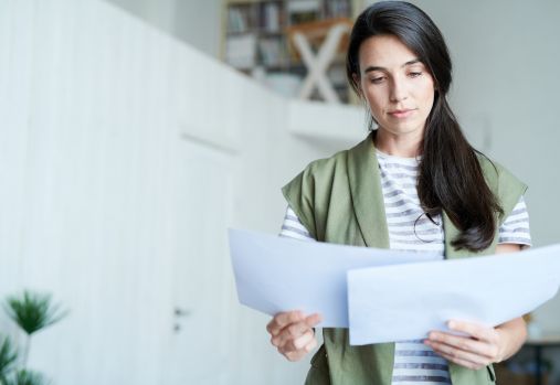 woman reading papers
