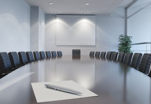 Boardroom Table with Paper and Pen