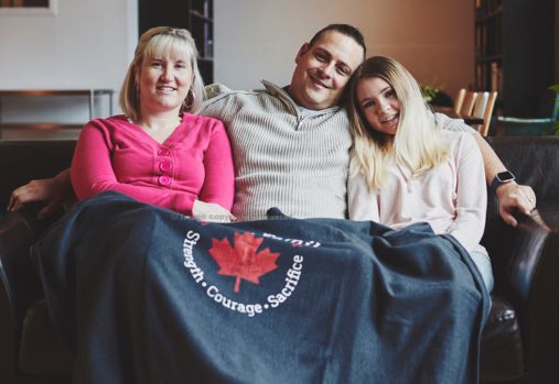 family sitting on couch