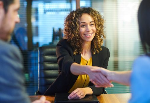 woman shaking hands in interview