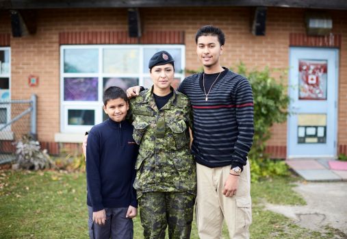 family in front of house