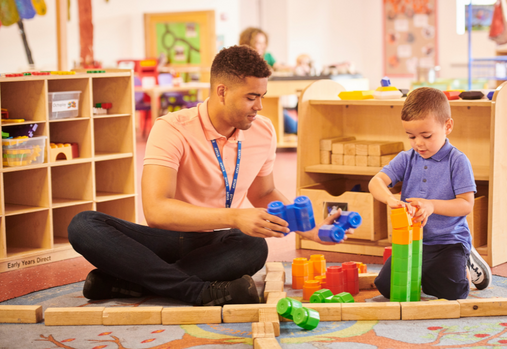 man and child playing 