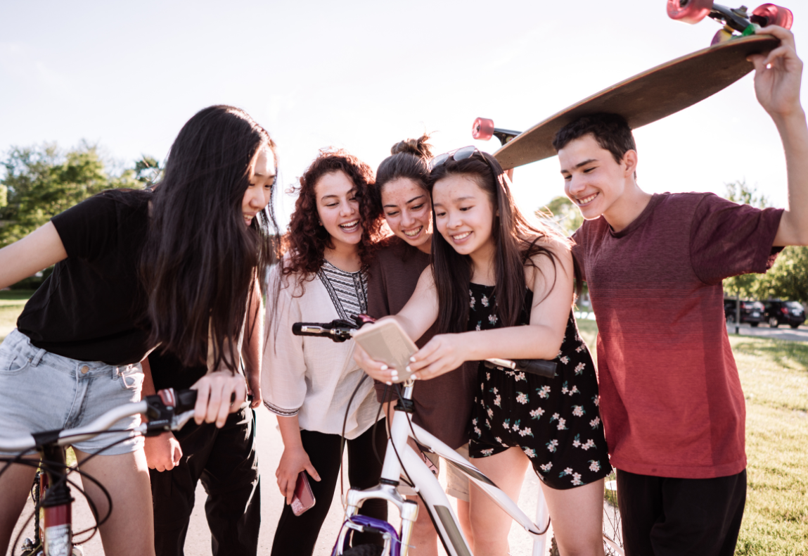 Teens looking at a phone 