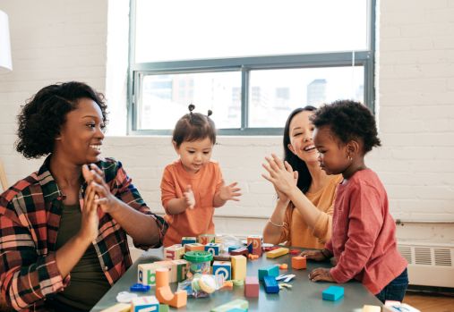 mothers and children playing