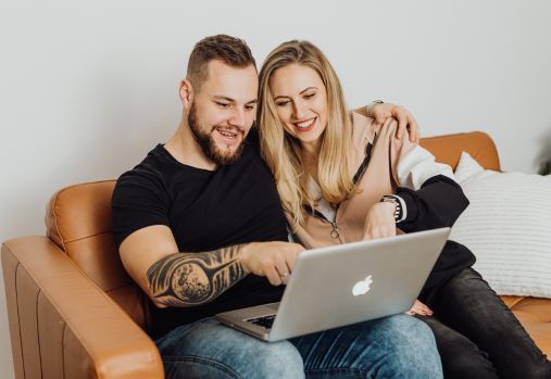 couple using laptop