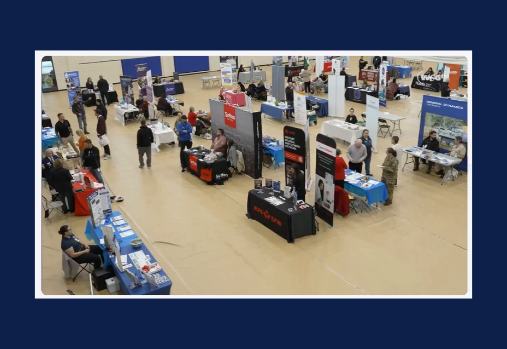 an arial view of the 2025 Shilo Symposium (vendors set up on a gym floor)