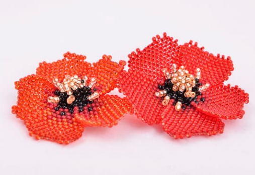 2 poppies crafted out of tiny beads