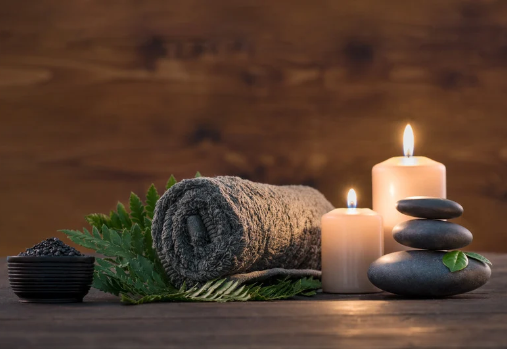 Spa Treatment set with candles and stones and towel