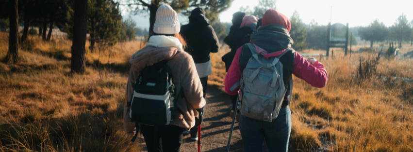people hiking in a fall setting