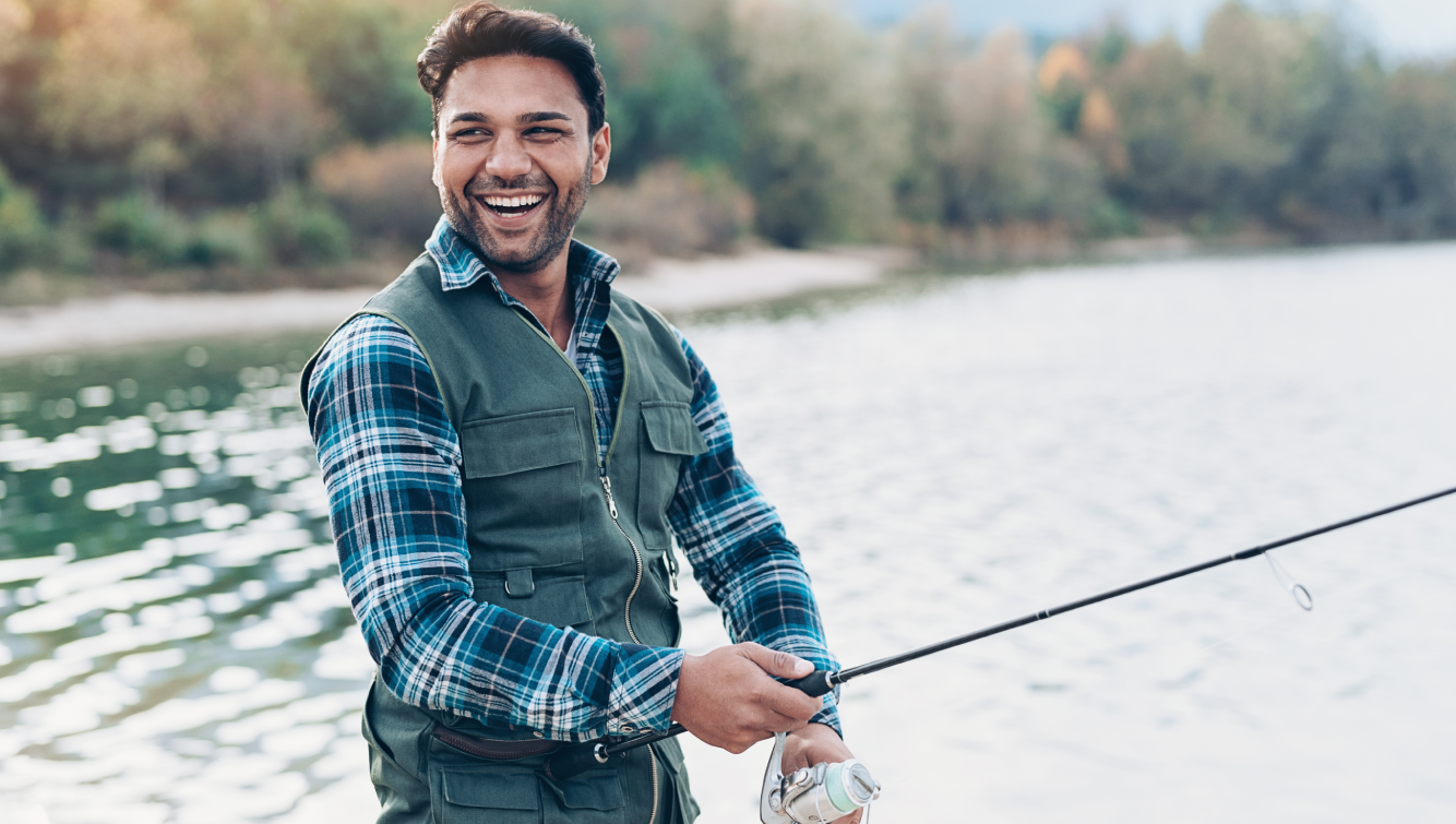 Smiling man fishing