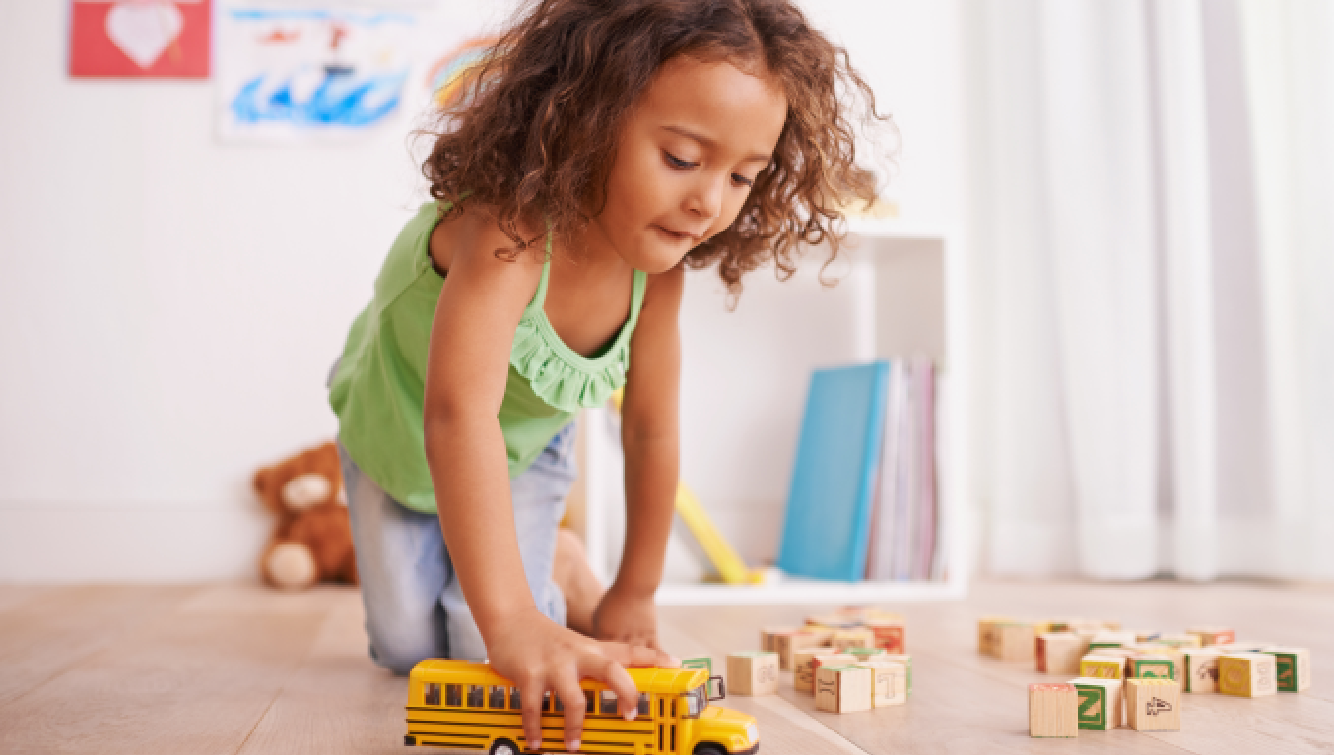 little girl playing on floor